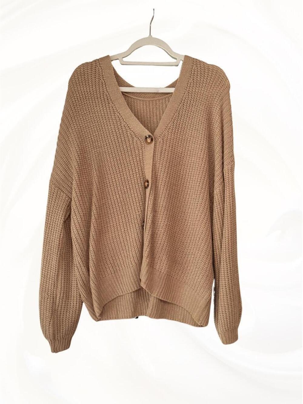 Tan oversized chunky knit cardigan.